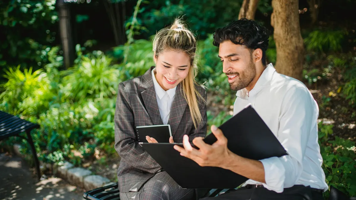 Business professionals collaborating on document control workflows in a professional services firm