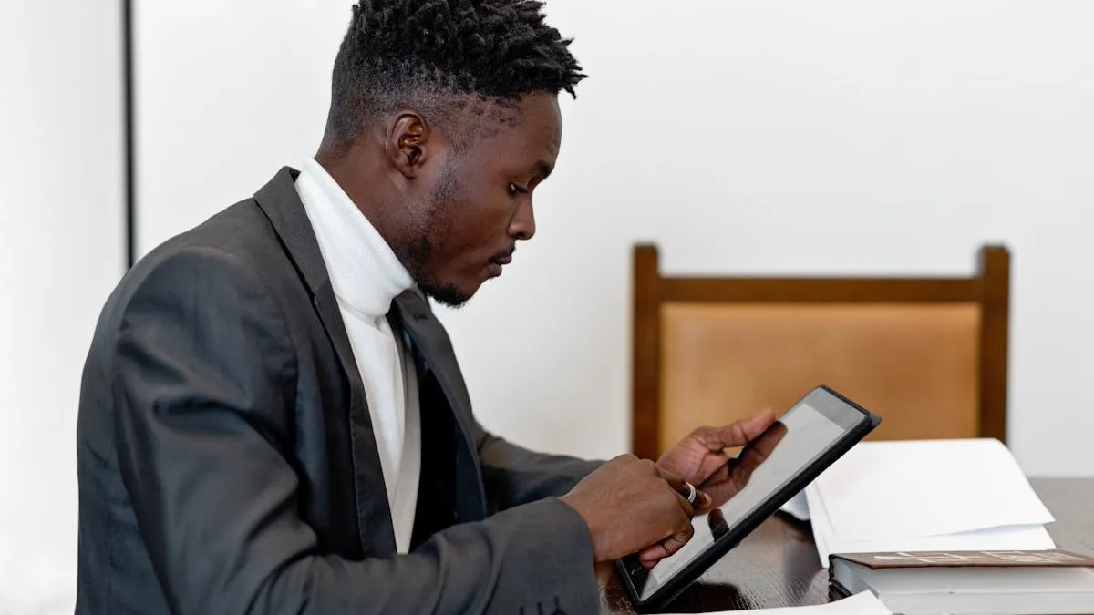 Office worker reviewing engineering documents and using a tablet for version control