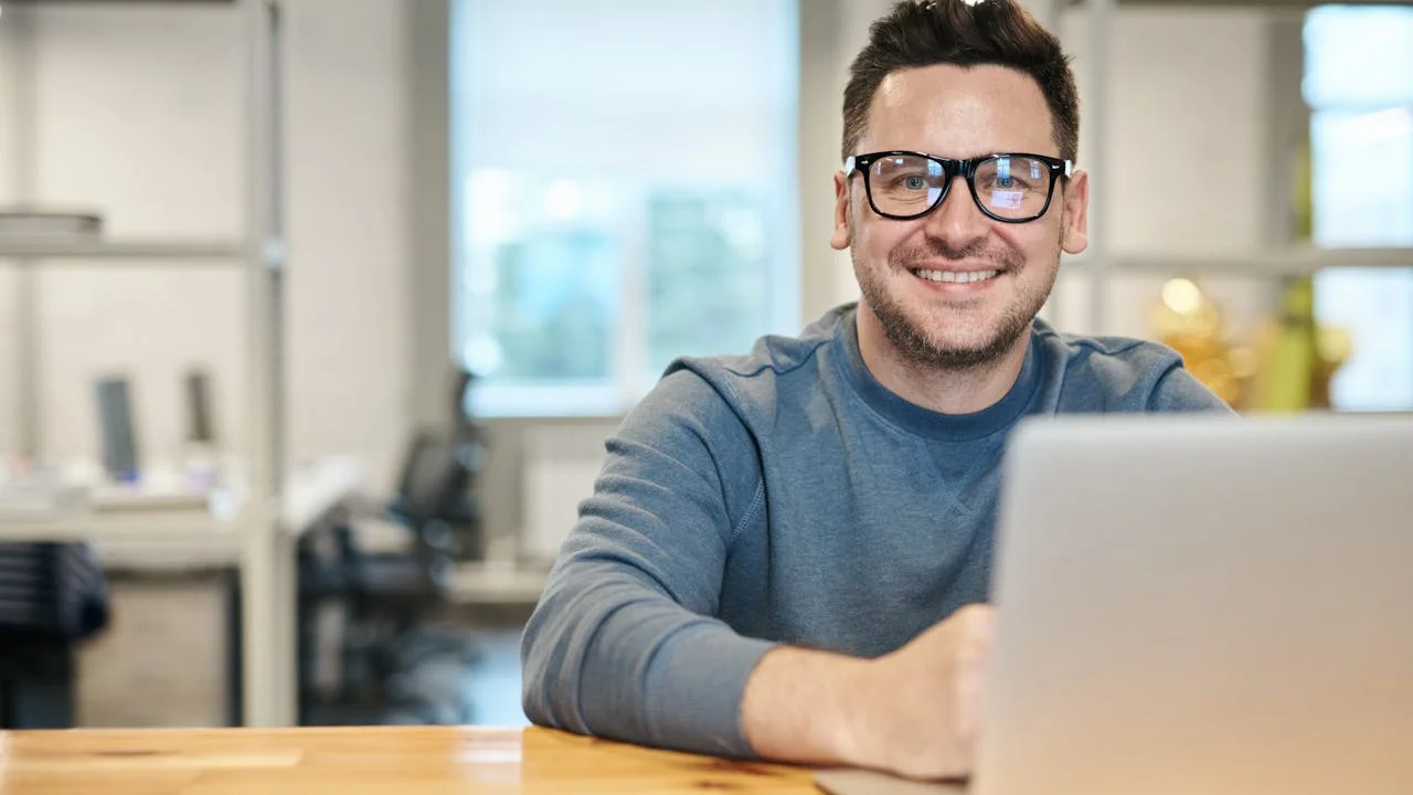 Professional comparing cloud document management platforms on laptop